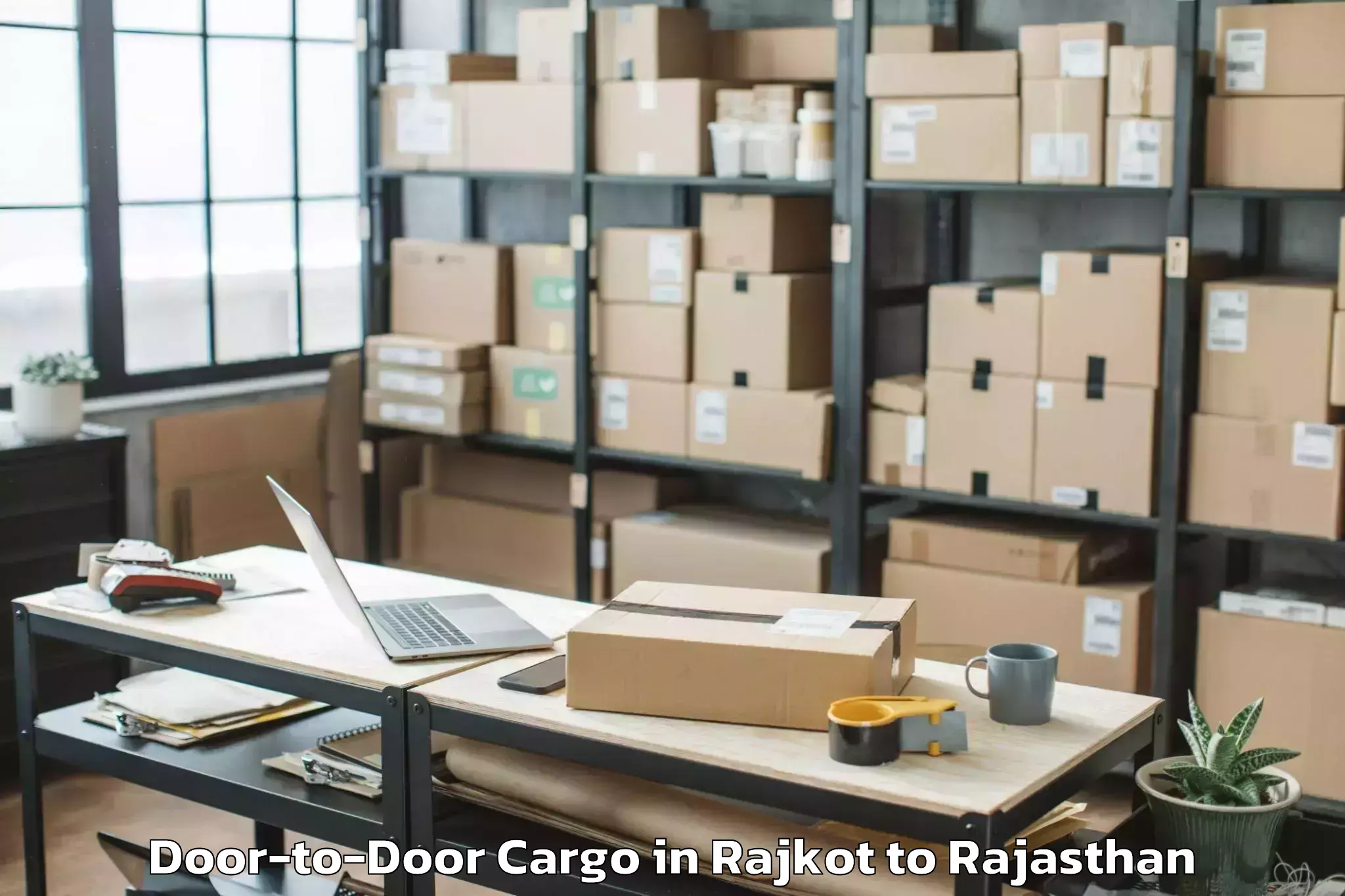 Top Rajkot to Niwai Door To Door Cargo Available